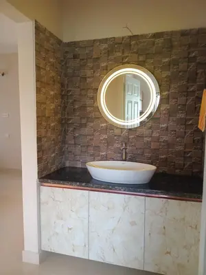 a bathroom with a sink and a mirror at Dew Dreams Periyar Castle in Alwaye