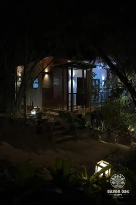 a house at night with the lights on at Silver Oak Resort Wayanad in Chithragiri