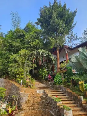 a set of stairs leading up to a house at Silver Oak Resort Wayanad in Chithragiri