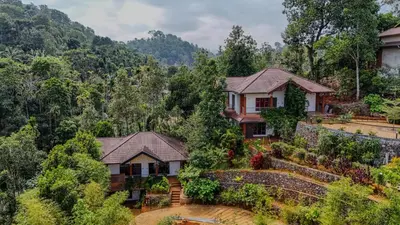 an aerial view of a house in the mountains at Silver Oak Resort Wayanad in Chithragiri