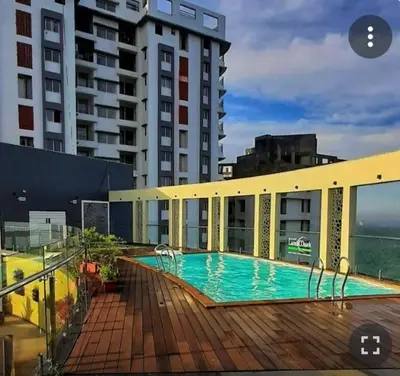 a swimming pool on the side of a building at Peace of mind in Kakkayam