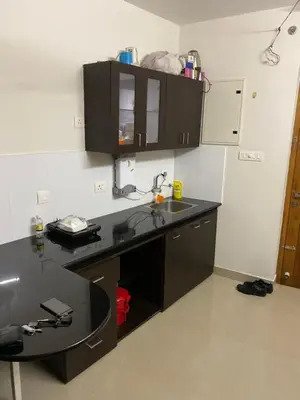 a kitchen with a black counter and a sink at Peace of mind in Kakkayam