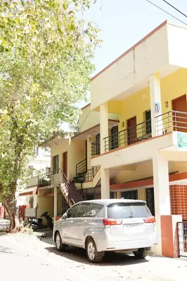a car parked in front of a building at Manasthala- Srinivas House Room1 in Mysore