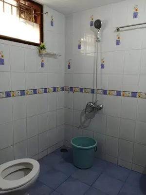 a bathroom with a toilet and a shower at SHI's Shenba 3BHk Villa Near Ganga Hospital Coimbatore in Coimbatore