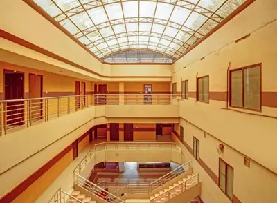 an empty hall with a glass ceiling in a building at Marhaba tourist home in Kunnamangalam