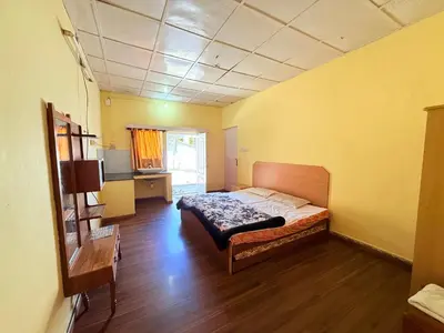 a bedroom with a bed in a room at Ubuntu Retreat - Aaram & Mukaam in Ooty