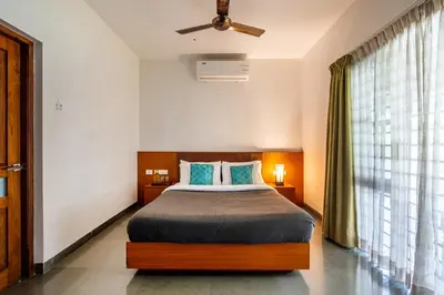 a bedroom with a bed and a large window at Senaro Luxury Farm in Agali