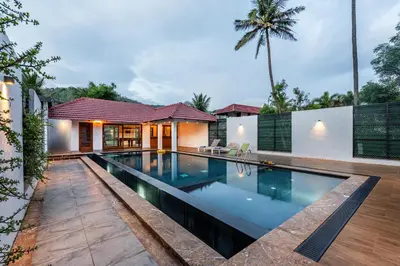 a swimming pool in the backyard of a house at Senaro Luxury Farm in Agali