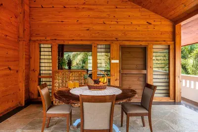 a dining room with a table and chairs at Senaro Luxury Farm in Agali