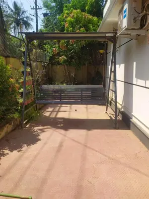 an entrance to a house with a metal gate at Mayoorvihar home stay Sulthaan Bathery Wayanad Kerala in Sultan Bathery