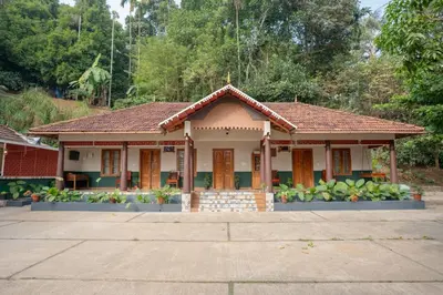 a house in the middle of a street at Swastha Heritage Homestays Wayanad in Kaniyāmbetta