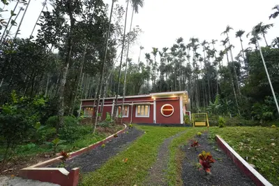a small house in the middle of a forest at Areca Valley Farmstay in Agali