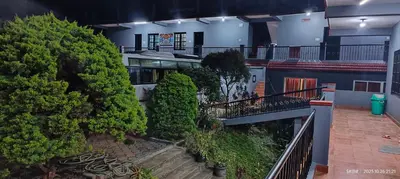 an overhead view of a building with trees at View Point Stay Coorg in Madikeri