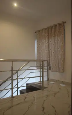 a room with a glass railing and a curtain at THE DEW stay Three bedroom villa in Kodaikānāl