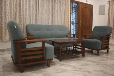 a living room with a couch and two chairs and a table at THE DEW stay Three bedroom villa in Kodaikānāl