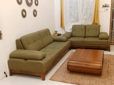 a living room with a couch and a coffee table at Casa by the hills in Kotagiri