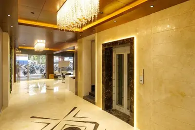 a lobby with a chinese writing on the floor of a building at Balu Residency - A Business Class Hotel in Coimbatore