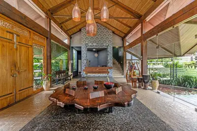 a large room with a wooden table in a house at Finch,Kotagiri in Kotagiri