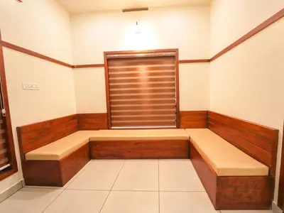 a empty room with a window and a bench at Oasis Apartment with Pool in Vythiri in Vythiri