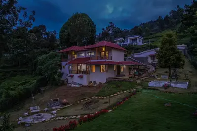 a house on top of a hill at night at Onella in Yedapalli