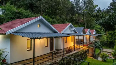 a row of cottages in a resort at Interlaken - 4 BR VIlla in Yedapalli