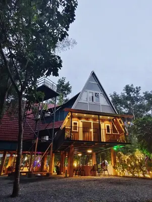 a house with a gambrel roof at River Valley Huts, Wayanad in Panamaram