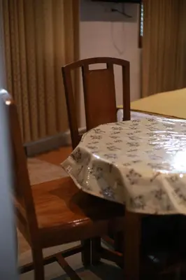 a table with a table cloth on top of it at Dreams Valley in Kadavoor