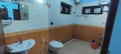 a bathroom with a toilet and a sink at Blooms Aquatica in Kenichira