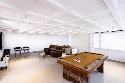 a living room with a pool table in it at Royal Plaza Inn by RAK Rooms, Calicut in Kozhikode