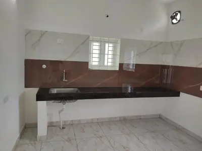 a bathroom with a sink and a mirror at Jeevakanthan Home Stay in Alāndurai