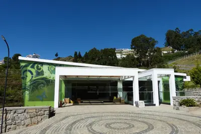 a building with a mural on the side of it at GReaT Trails Kodaikanal by GRT Hotels in Kodaikānāl