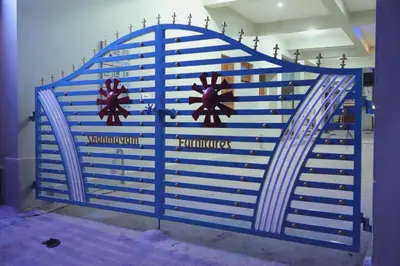 a blue gate in a room with at Athira Residency Coorg in Kushālnagar