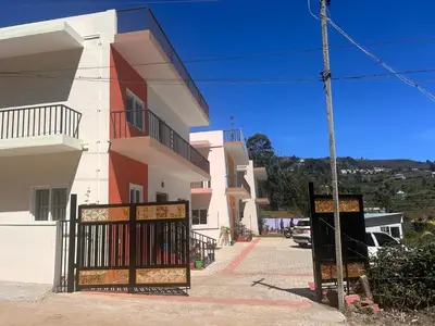 a building with a gate in front of it at Rio Grande Retreat in Kodaikānāl