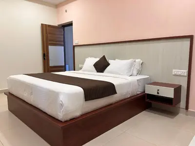 a bedroom with a large bed in a room at Rio Grande Retreat in Kodaikānāl