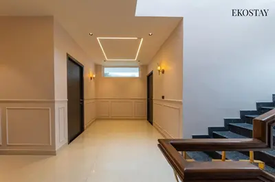 an empty hallway with stairs in a building at EKOSTAY - Amber Villa in Kodaikānāl