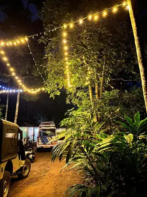 a string of lights hanging over a yard at night at Cardamom Garden Homestay Meppadi Wayanad in Meppādi