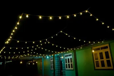 a string of lights over a house at night at Cardamom Garden Homestay Meppadi Wayanad in Meppādi