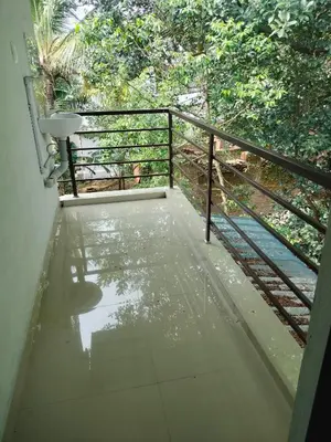 a view of a balcony with a metal railing at Aswathy Bhavan in Vadakkāncheri