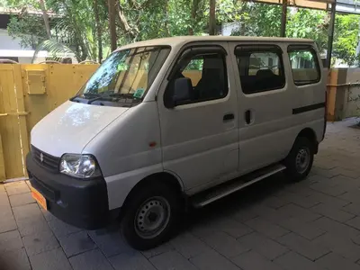 a small white van parked on a brickickedicked at Adi Deva Inn in Guruvāyūr