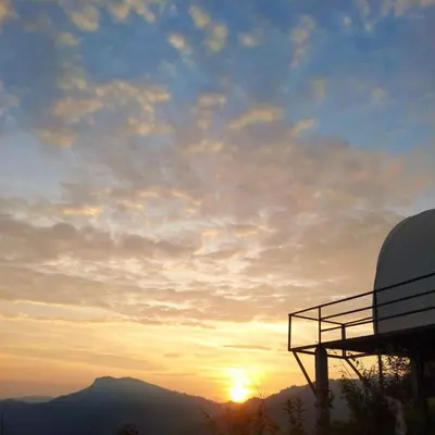 a view of the sunset from a observatory at Cocoon Creek in Kodaikānāl