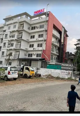 a man standing in front of a building at Guruvayoor Suits Pankaj Suits in Trichūr