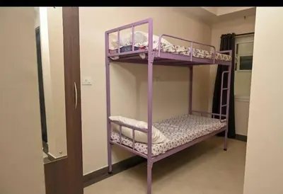 a couple of bunk beds in a room at Guruvayoor Suits Pankaj Suits in Trichūr