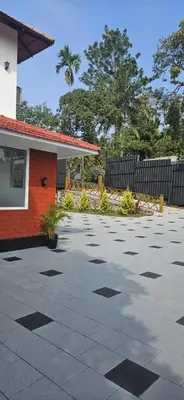 a parking lot in front of a house at Royal Heaven in Ambalavayal