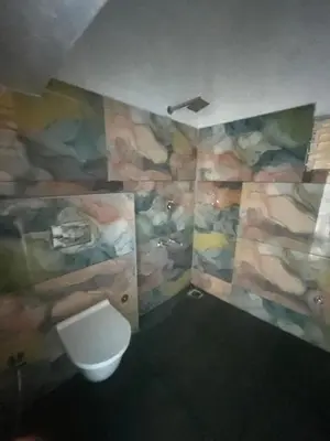 a bathroom with a sink and a toilet at Chamundi Temple-Hill View in Mysore