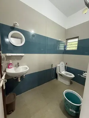 a bathroom with a sink and a toilet at Anya Retreats Nature Homestay in Kushālnagar