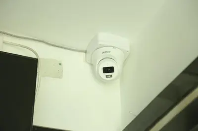 a security camera on the side of a wall at S M Residency in Tiruppūr