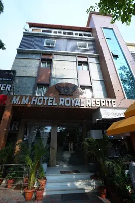 a building with a sign that reads multipolis hotel royal reserve at M M Hotel Royal Respite in Coimbatore