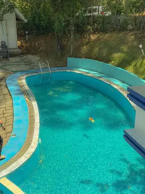 an overhead view of a swimming pool at The Heights Munnar in Munnar