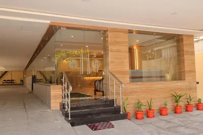 a lobby of a building with potted plants at Hotel Le Palace in Coimbatore