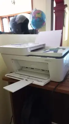 a white printer sitting on top of a desk at Sree Nandhavanam Homestay in Guruvāyūr